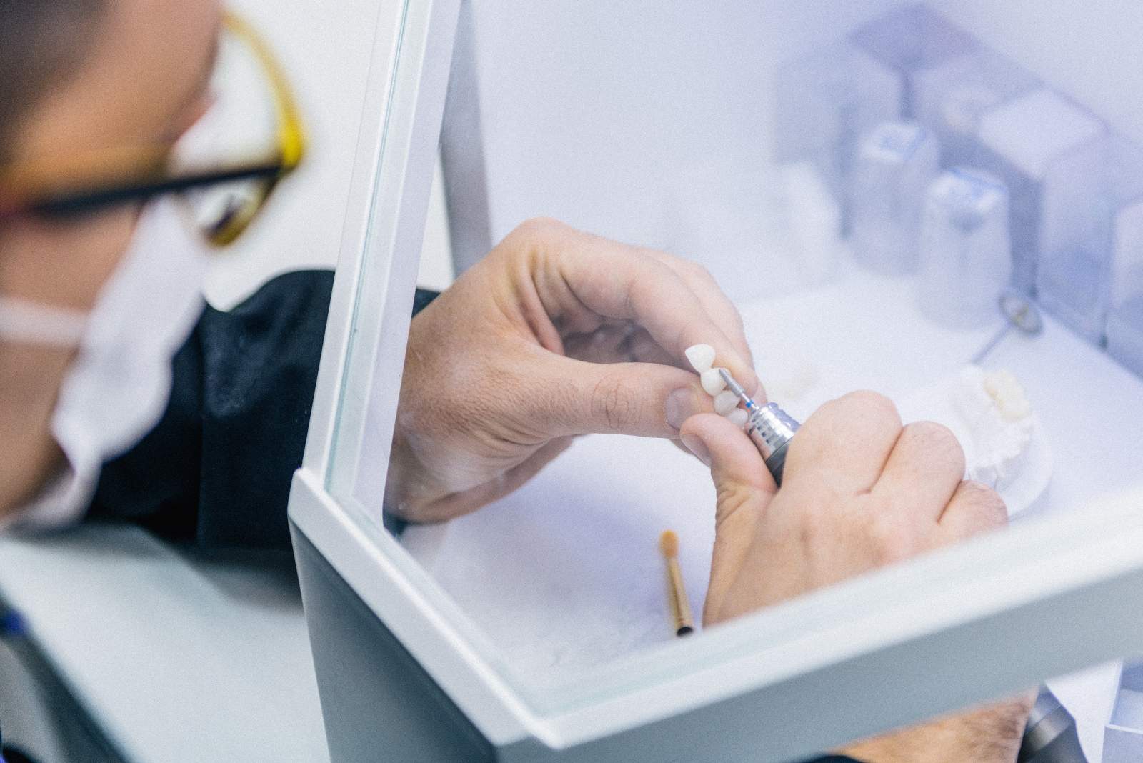 Denture technician working on dentures