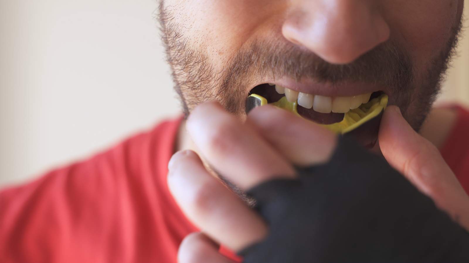 Person inserting mouth guard